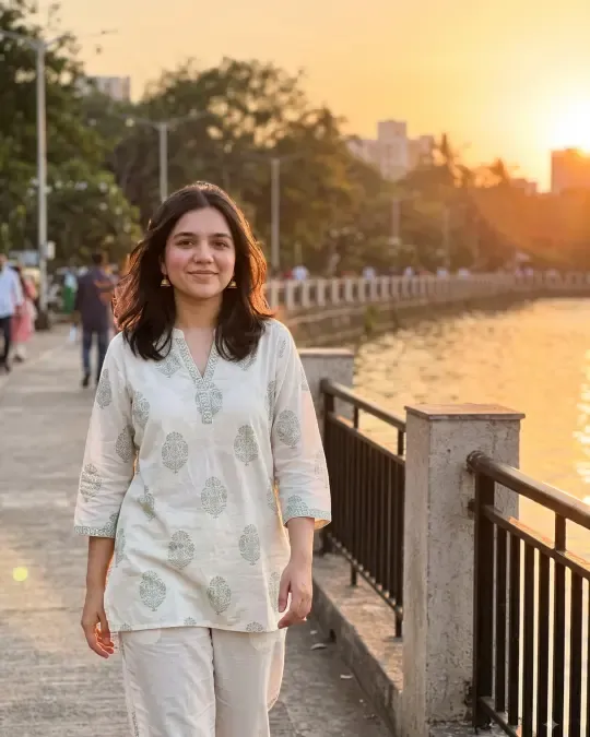AI-generated image of Rutu in a white printed cotton co-ord set by a lake at sunset